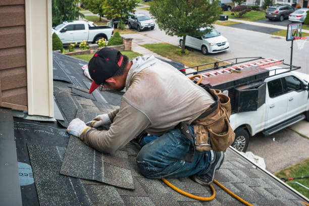 Professional Storm Damage Roof Repair technician working in Foster, OK